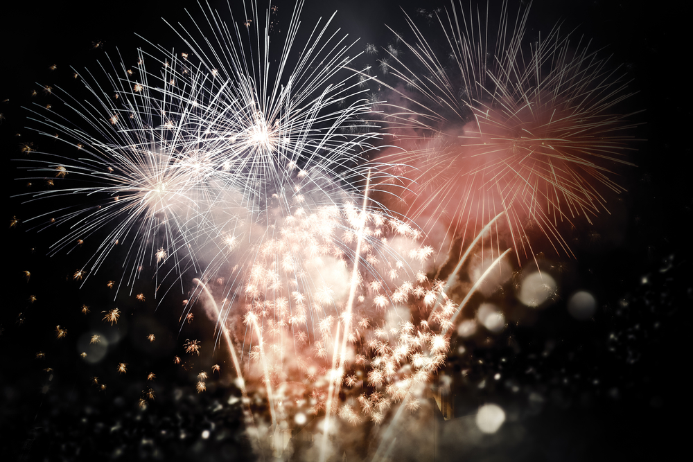 Colorful fireworks bursting in night sky during New Year celebration